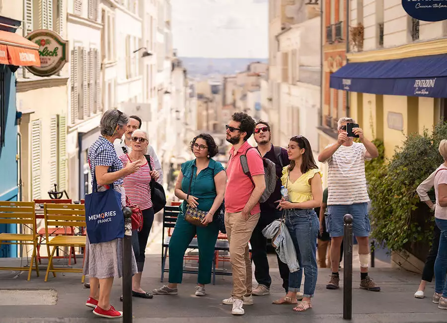 Listening to a guide on the Montmartre Artists Quarter Tour