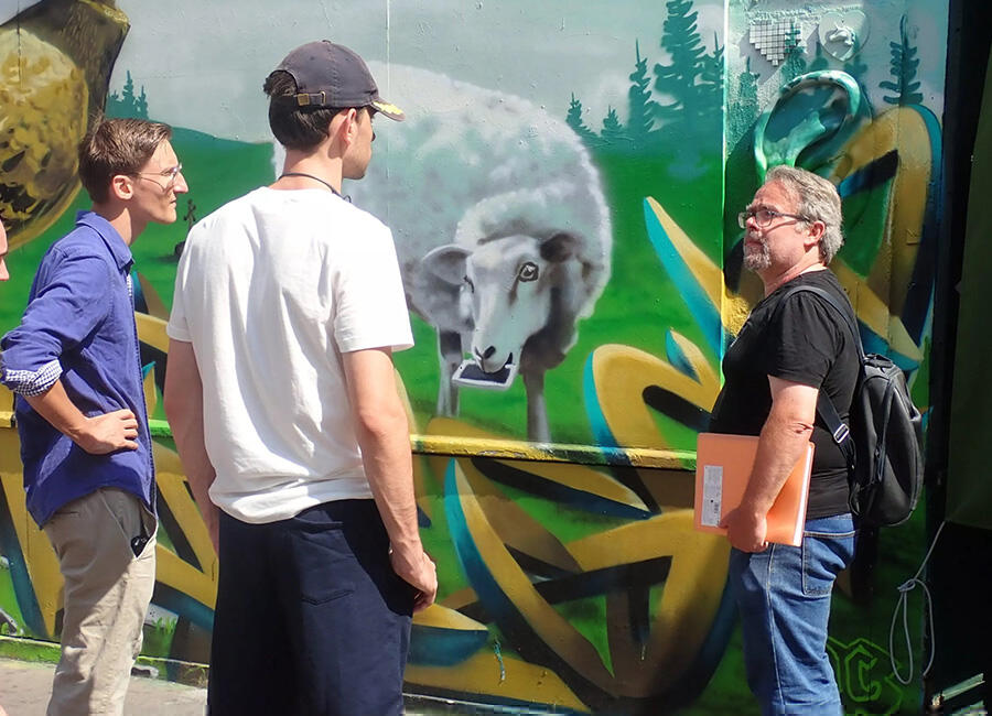 Looking at street art of a lamb in Paris